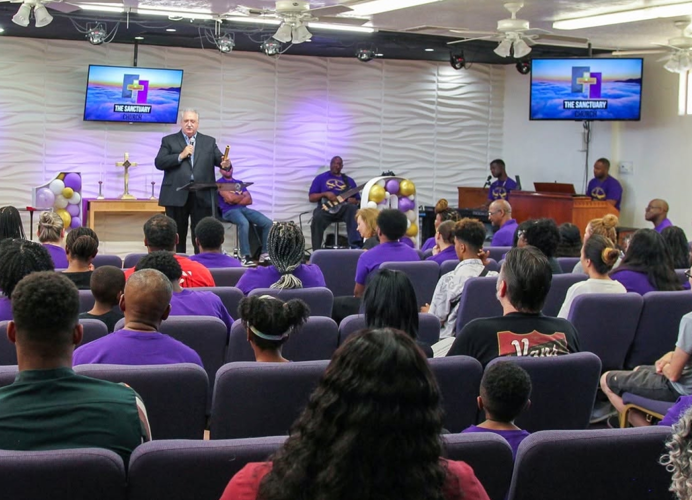 Congregation gathered inside The Sanctuary Church during a worship service.
